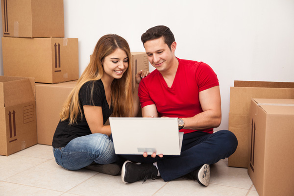 photo of a couple buying moving boxes online