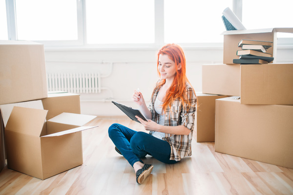 woman preparing a moving checklist