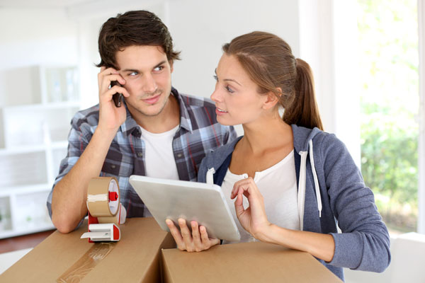 couple calling a moving company