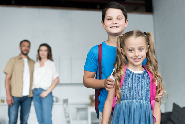 photo of kids going to new school after relocation